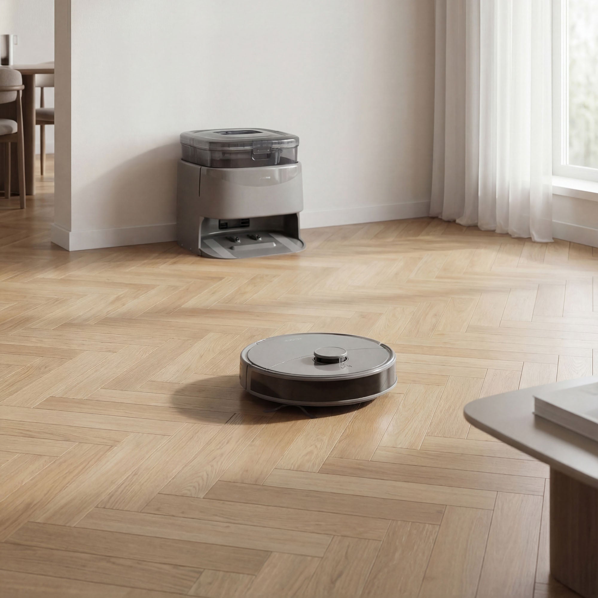 Robot vacuum cleaner on a wooden floor with a cleaning station in the background.