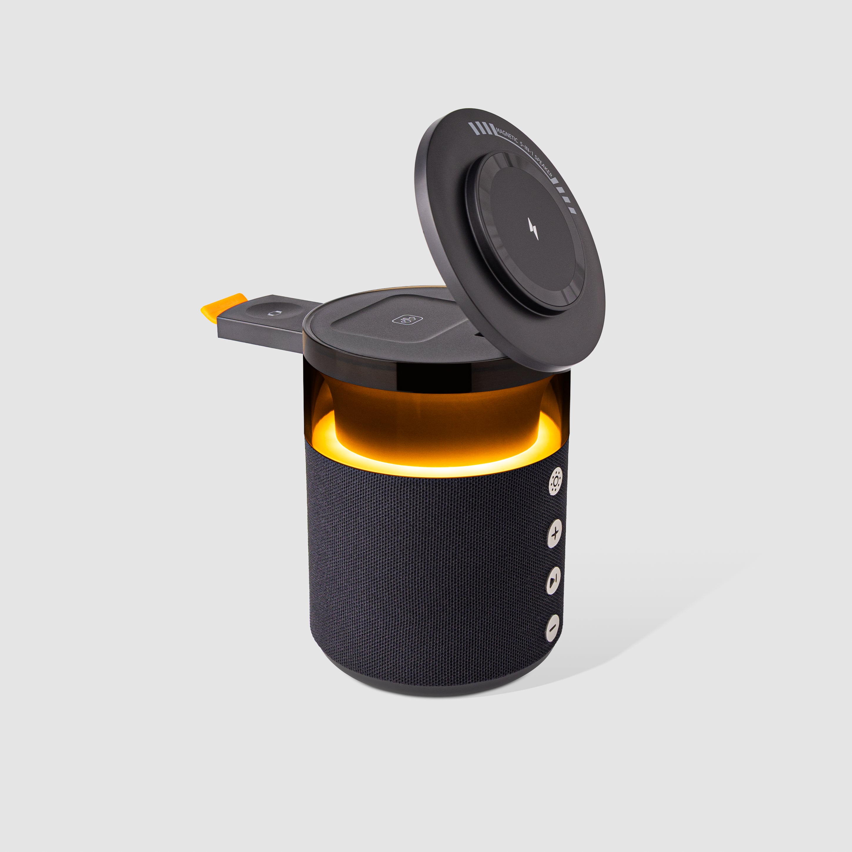 Black portable speaker with a glowing interior on a light gray background