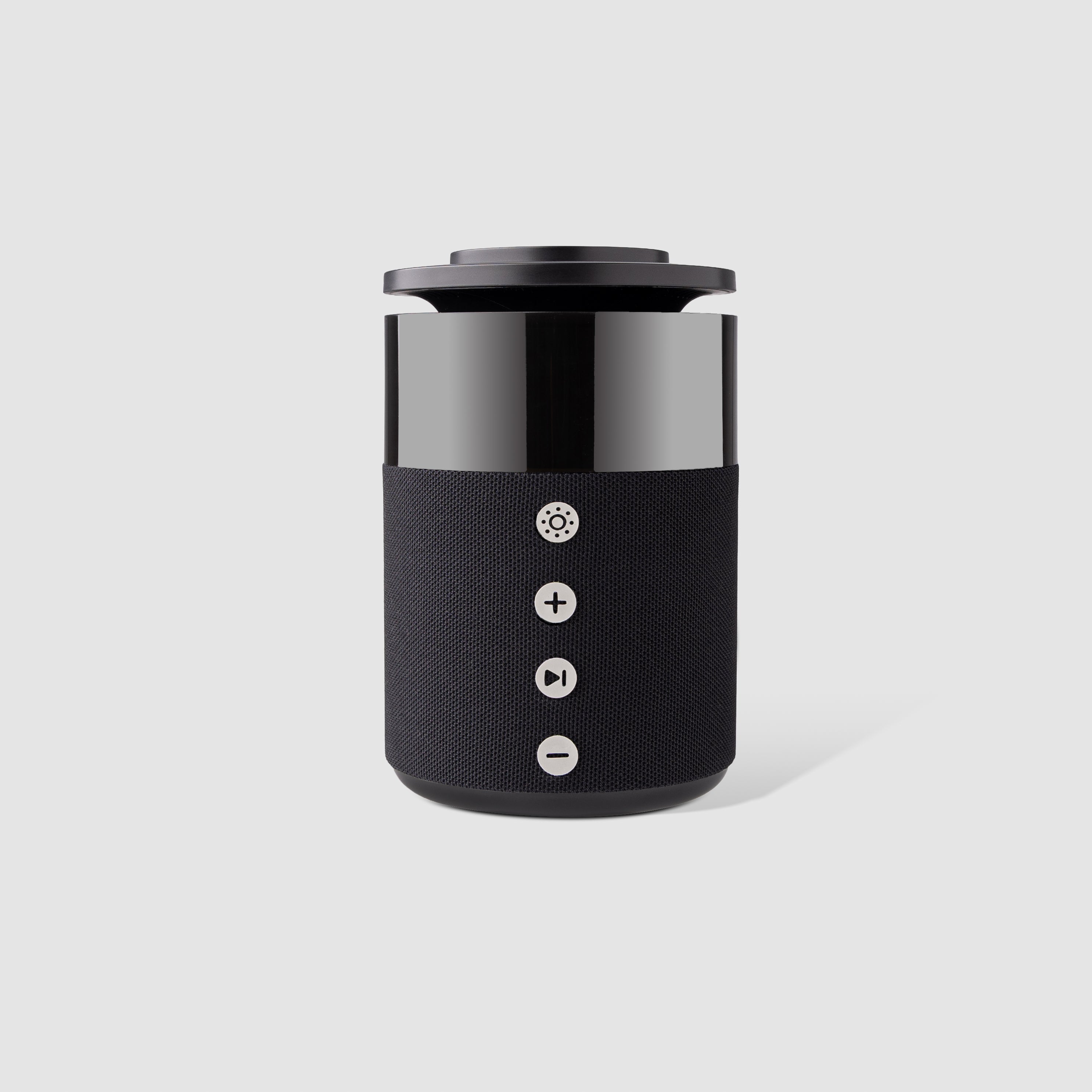 Black cylindrical device with control buttons on a light gray background